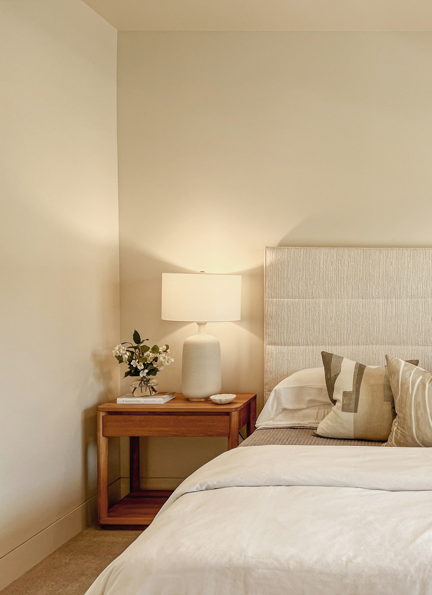 A calm bedroom in beige tones with linen bedding