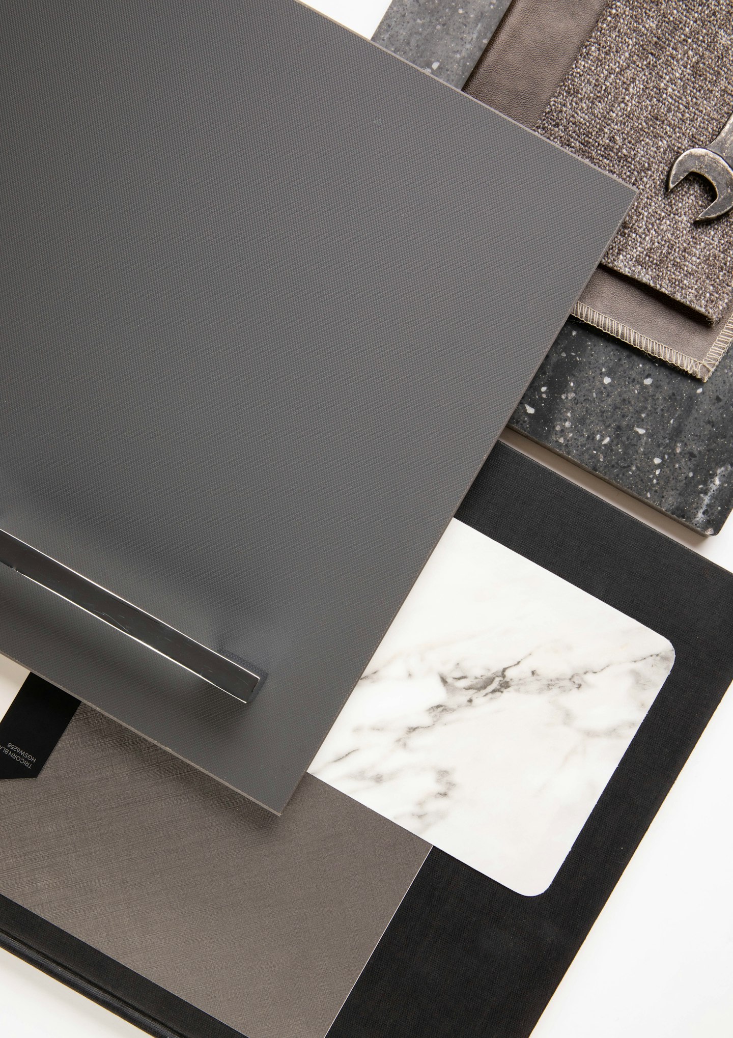 Dark material samples arranged on marble