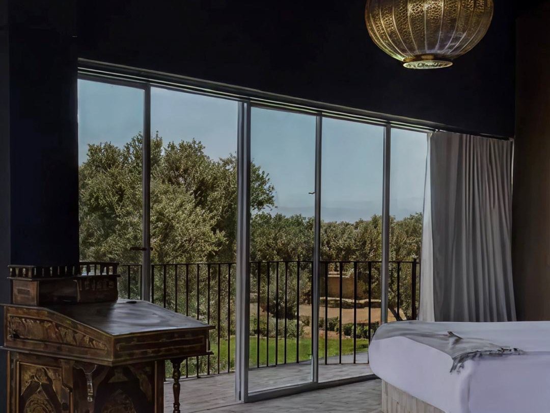 Villa YAH, Marrakech: a suite with panoramic windows onto the olive grove